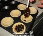 Filling mince pies.