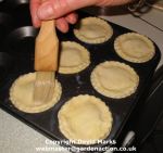 Brush mince pie tops with milk