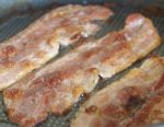 Frying the streaky bacon