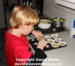 Put cakes cases in baking tray.