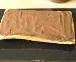 Mocha filling spread on the sponge.