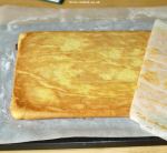 Removing the baking paper from the sponge