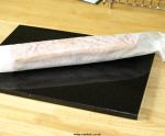 Sponge rolled up in baking paper
