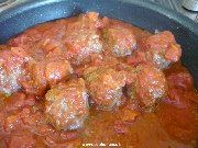 Meatballs cooking in a pan