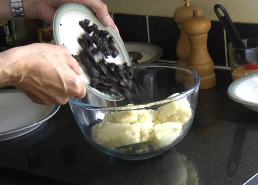 Add black pudding to mashed potato