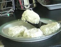 Potato cakes coated in egg and flour