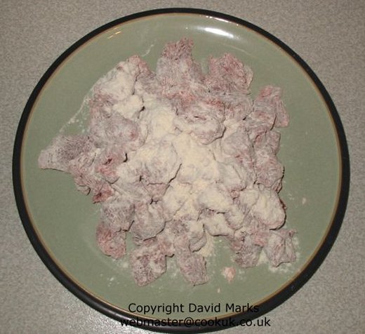 Mix flour with the steak cubes