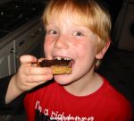 Child eating a chocolate flapjack
