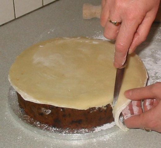 Place marzipan on top of Christmas cake