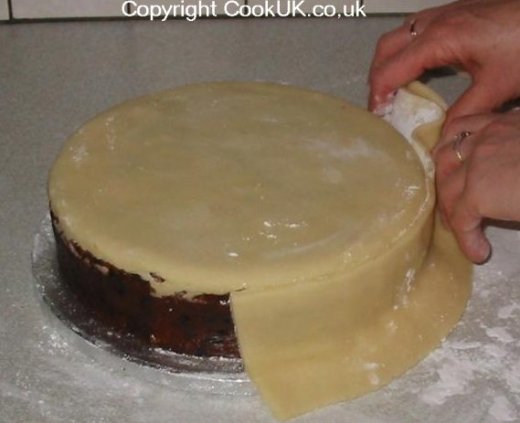 Marzipan sides onto Christmas cake