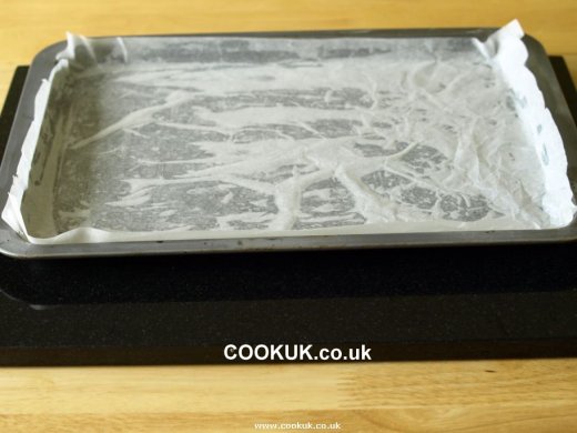 Line baking tray with baking paper