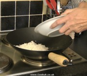 Frying rice in a wok