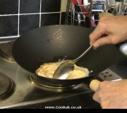 Frying egg in a wok