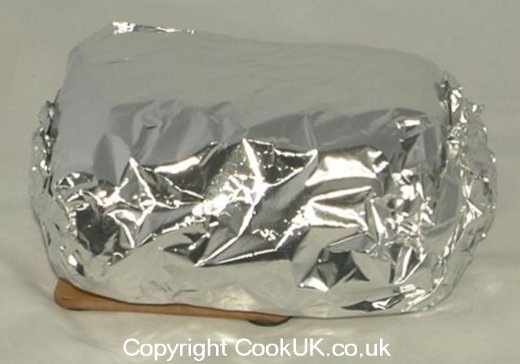 Sirloin steak in kitchen foil for freezer