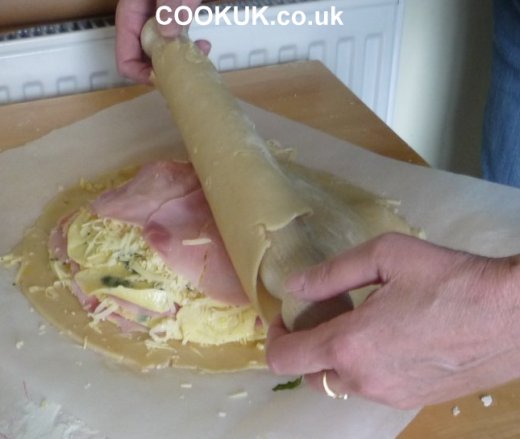 Placing pastry on galette