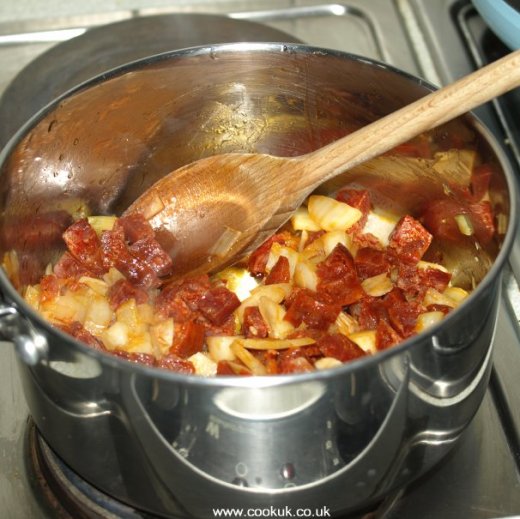 Chorizo, onions and garlic frying in a pan