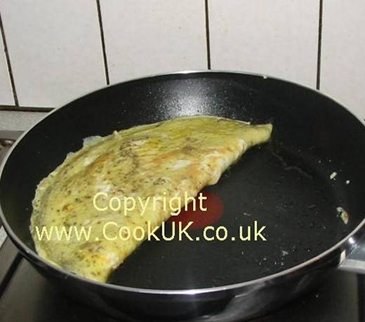 Turn omelette top half over bottom half