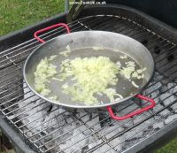 Frying onions on a barbecue