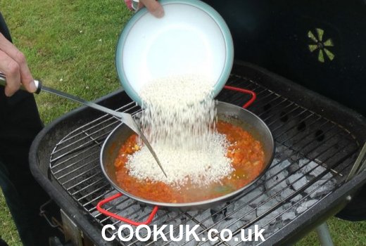 Rice added to paella