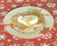 Poached egg with yolk broken