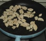 Chicken frying in a pan