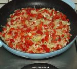Frying onions and red peppers