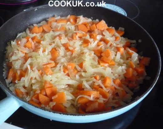 Frying onions, carrots and swede