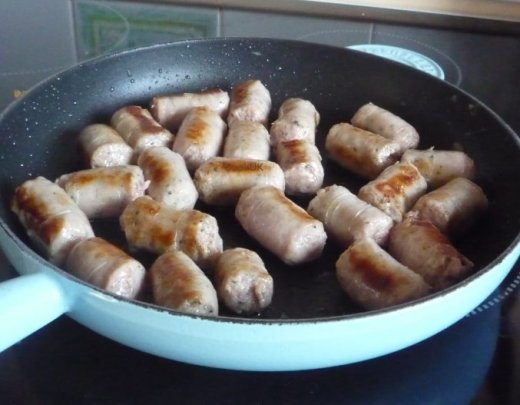 Frying sausages