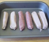 Sausages in the roasting tin